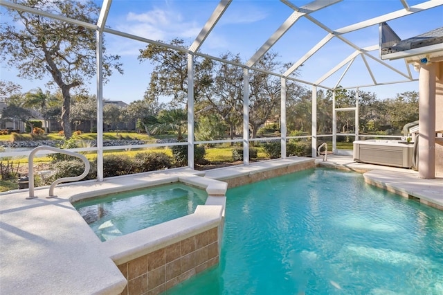 view of swimming pool featuring a patio, glass enclosure, and an in ground hot tub