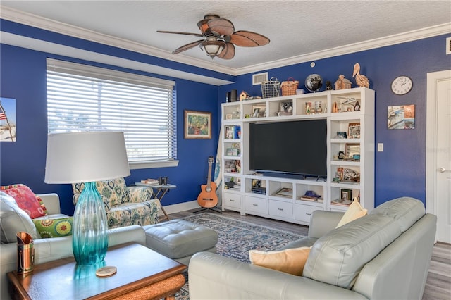 living room featuring a textured ceiling, ceiling fan, ornamental molding, and hardwood / wood-style floors