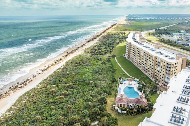 bird's eye view with a water view and a beach view