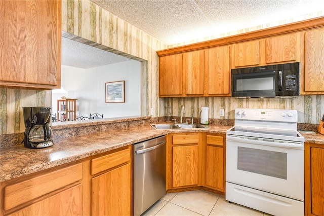 kitchen featuring light tile patterned flooring, a textured ceiling, stainless steel dishwasher, white range with electric cooktop, and sink