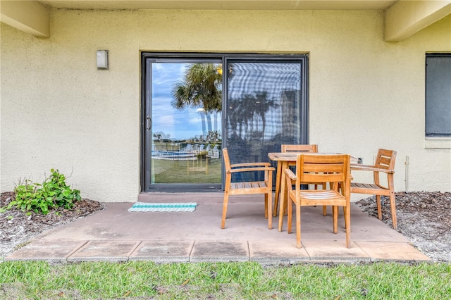 entrance to property featuring a patio area