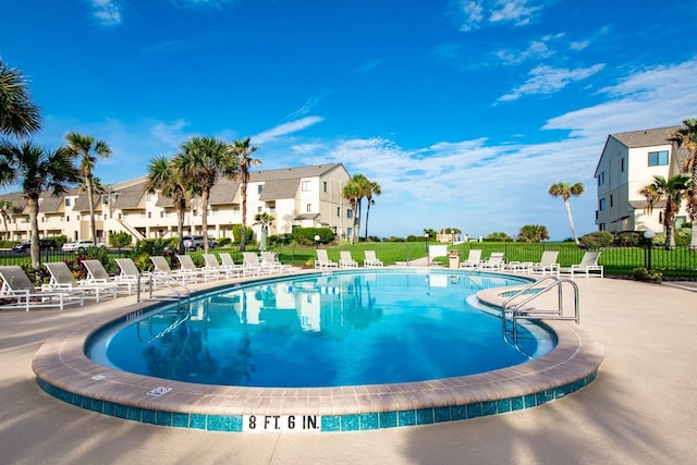 view of swimming pool with a patio area