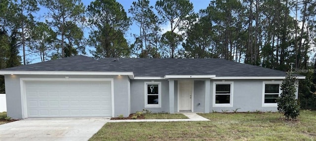 ranch-style home with a garage and a front yard