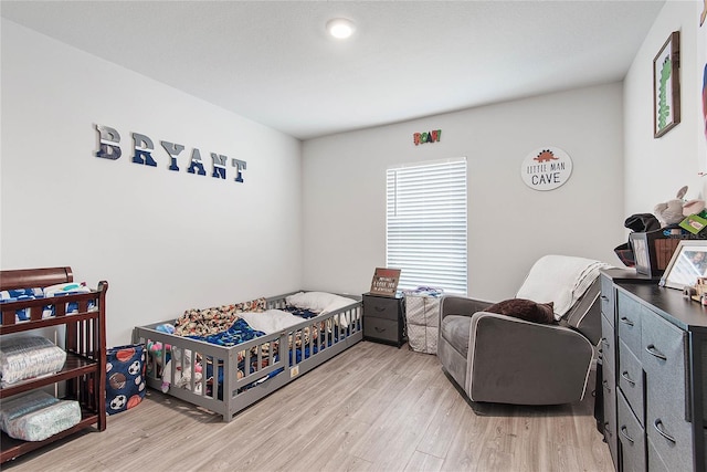 bedroom with light wood-style flooring