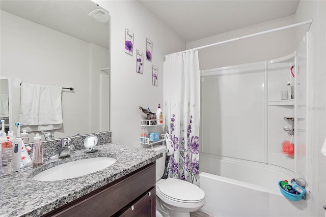 bathroom featuring vanity, toilet, and shower / bath combo with shower curtain