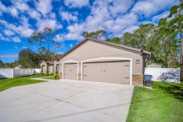 exterior space with a garage and a lawn