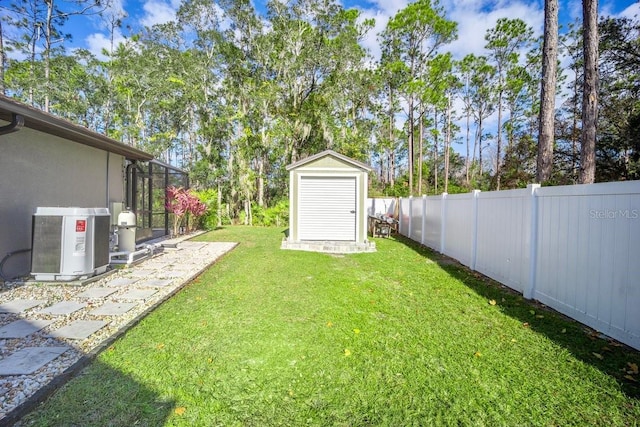 view of yard with a shed and glass enclosure