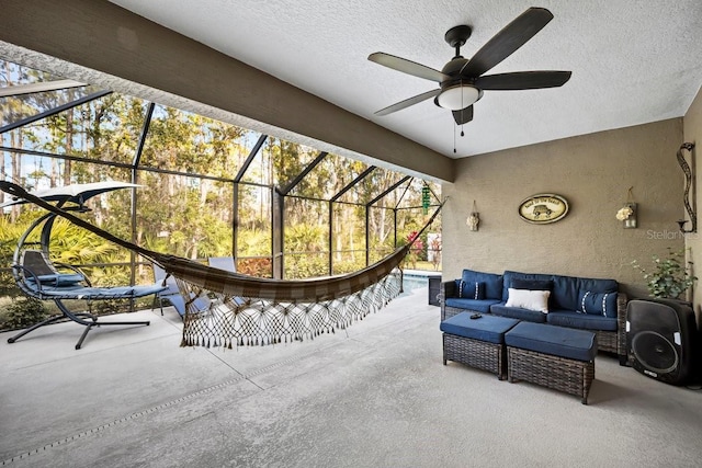 view of patio featuring an outdoor living space and a lanai