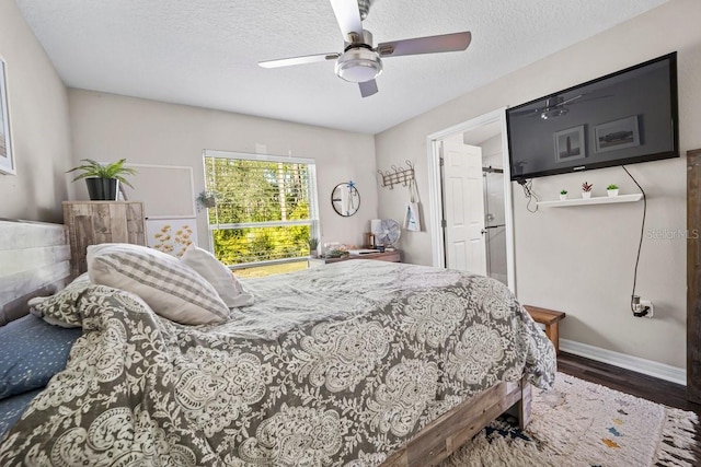 bedroom featuring hardwood / wood-style floors, a textured ceiling, and ceiling fan