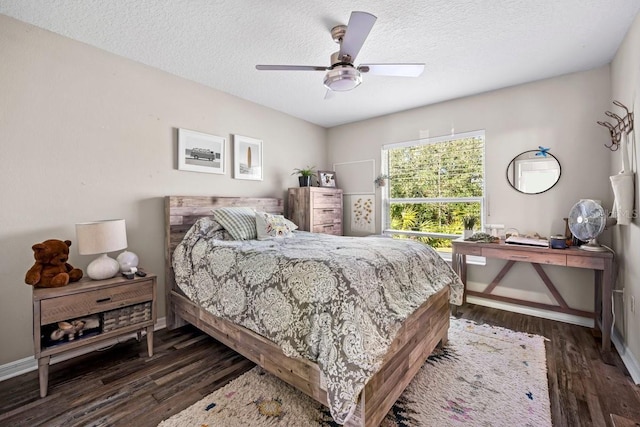 bedroom with a textured ceiling, dark hardwood / wood-style floors, and ceiling fan