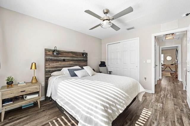 bedroom with wood-type flooring, a closet, and ceiling fan