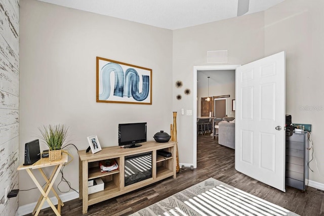 home office with dark wood-type flooring