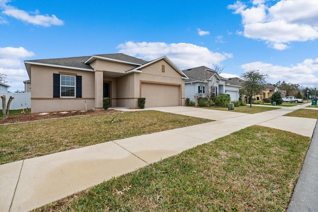 view of front of property featuring a garage and a front yard