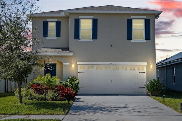 view of front of property with a garage