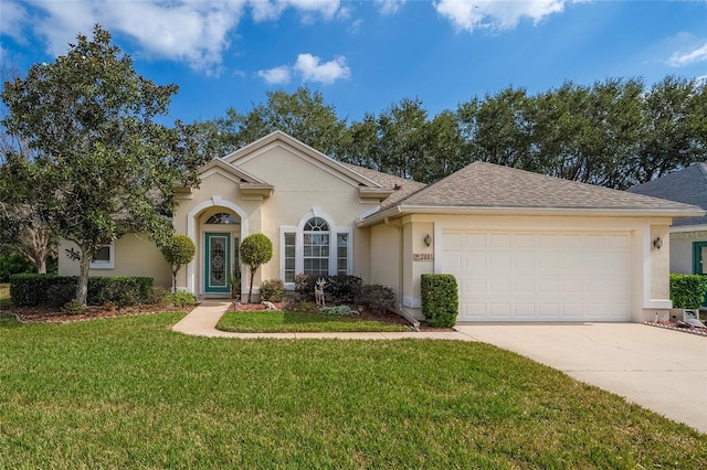 single story home featuring an attached garage, driveway, a front yard, and stucco siding