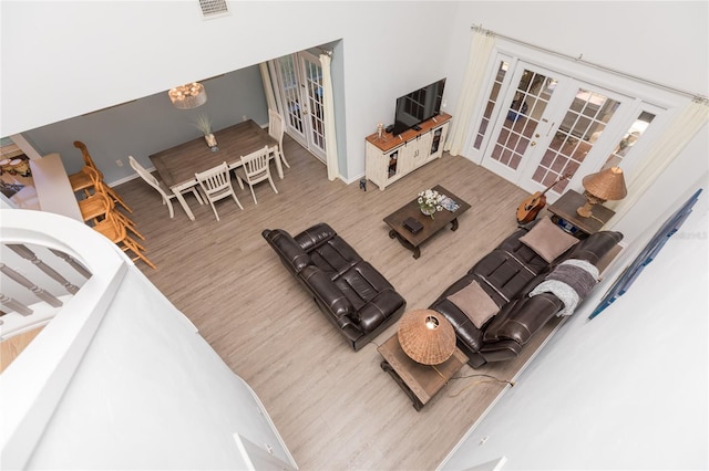 living room featuring wood-type flooring and french doors