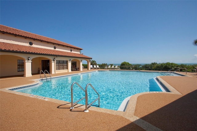 view of swimming pool with a patio area