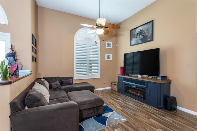 living room with dark hardwood / wood-style floors and ceiling fan