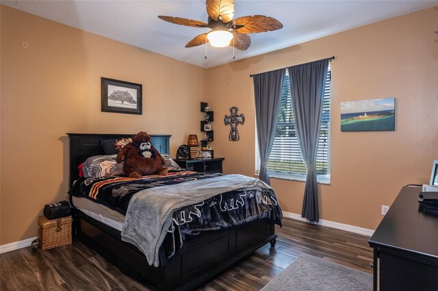bedroom with ceiling fan and dark hardwood / wood-style floors