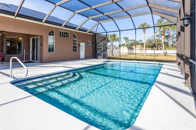 view of pool featuring a lanai and a patio area