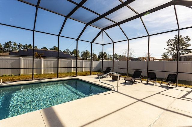 view of pool featuring a lanai and a patio