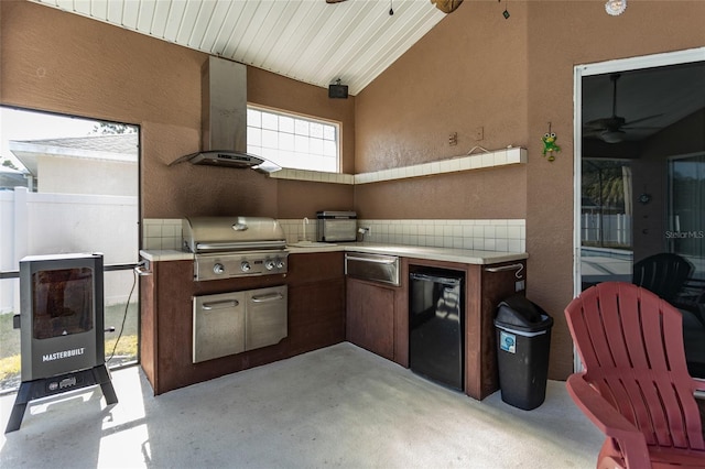 view of patio with a grill, area for grilling, and ceiling fan
