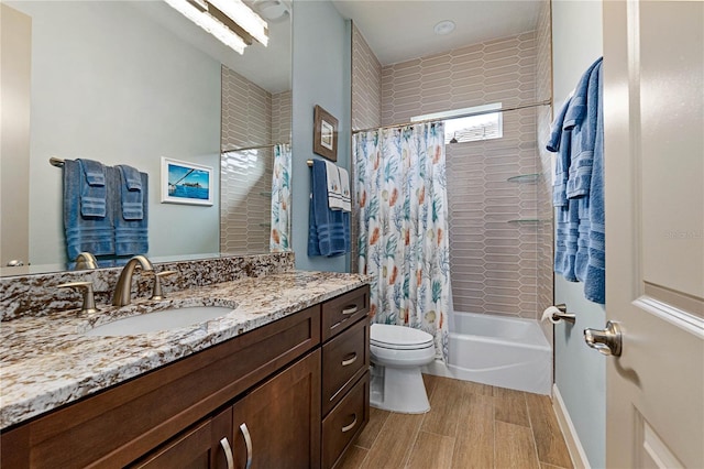 full bathroom featuring vanity, toilet, and shower / tub combo with curtain