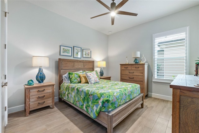 bedroom featuring ceiling fan and light hardwood / wood-style floors