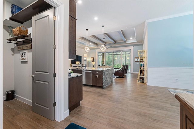 kitchen featuring decorative light fixtures, dark brown cabinets, light hardwood / wood-style flooring, dishwasher, and beam ceiling