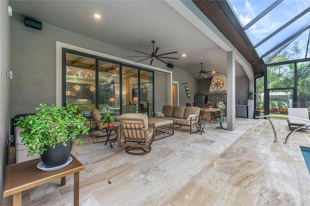 sunroom featuring ceiling fan and lofted ceiling