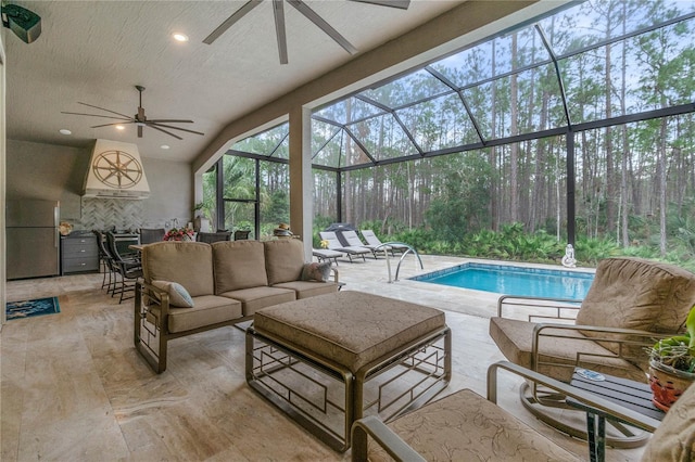 exterior space featuring an outdoor living space, a lanai, a patio area, and ceiling fan