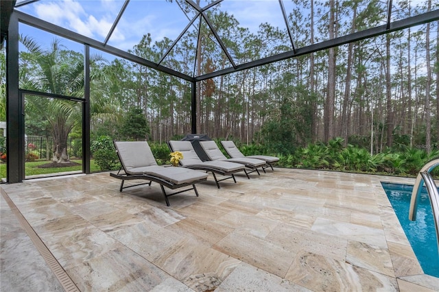 view of patio / terrace featuring a lanai