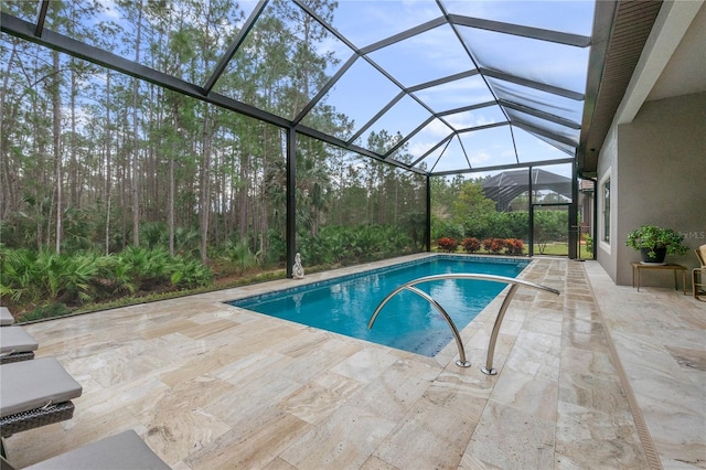 view of pool with a lanai and a patio