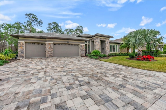 view of front of home with a garage and a front yard