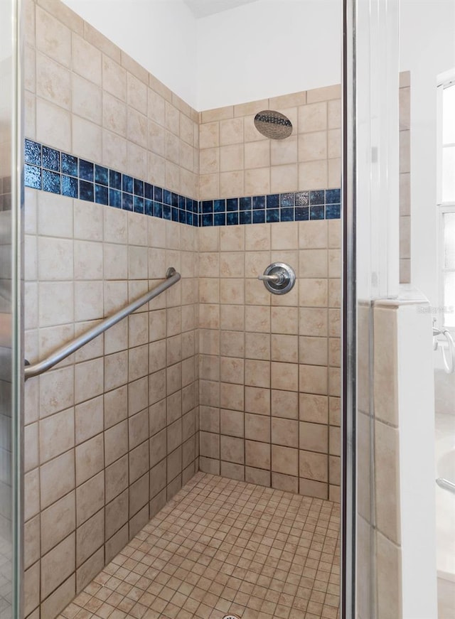 bathroom with tiled shower