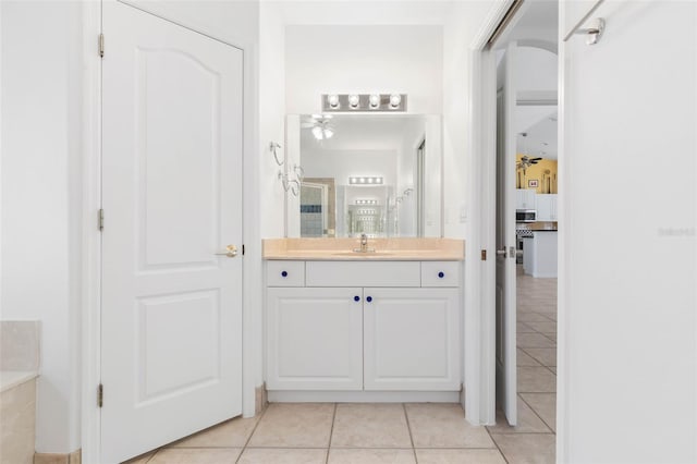 bathroom with tile patterned flooring and vanity