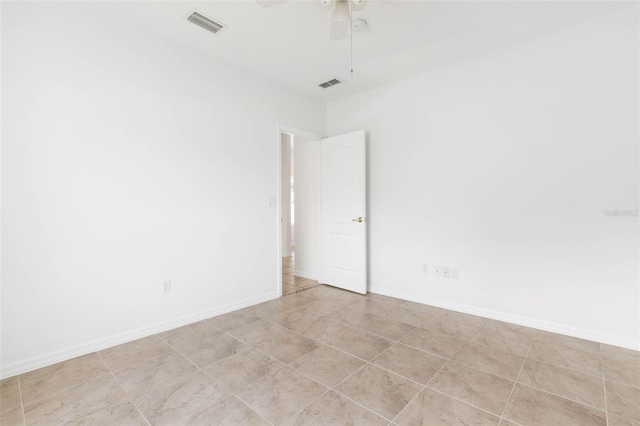 spare room with ceiling fan