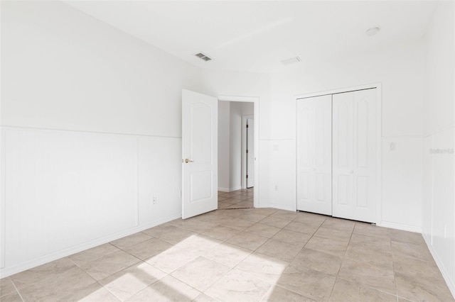 unfurnished bedroom featuring a closet