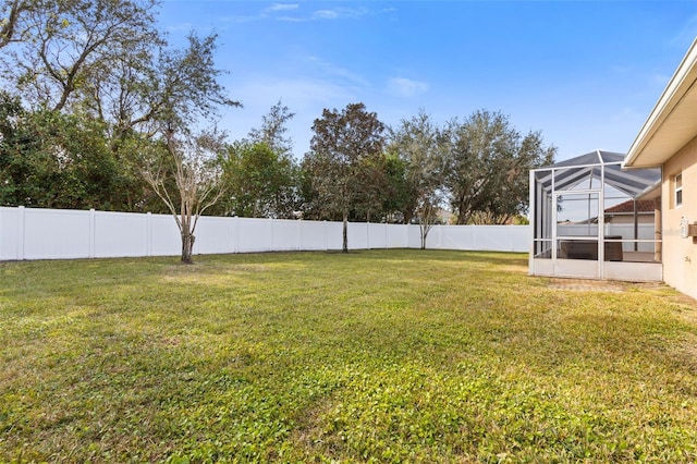 view of yard with a lanai