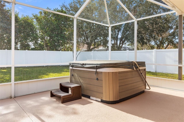 unfurnished sunroom with a hot tub