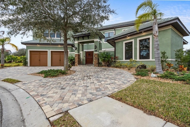 view of front of property featuring a garage