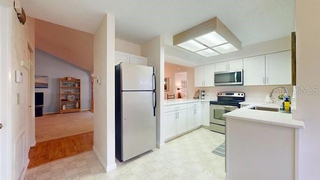 kitchen featuring sink, white cabinetry, and stainless steel appliances