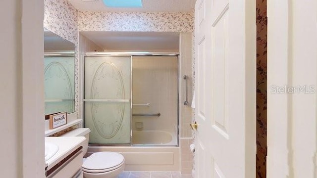 full bathroom featuring vanity, toilet, and enclosed tub / shower combo