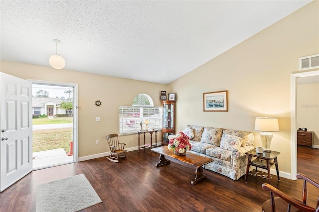 living room with dark hardwood / wood-style floors and vaulted ceiling