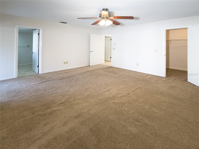 carpeted empty room with ceiling fan