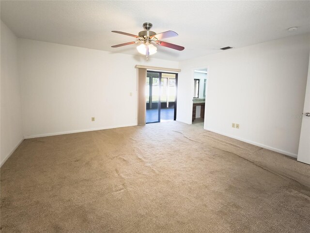 carpeted empty room with ceiling fan