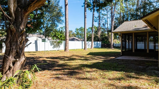 view of yard featuring a sunroom