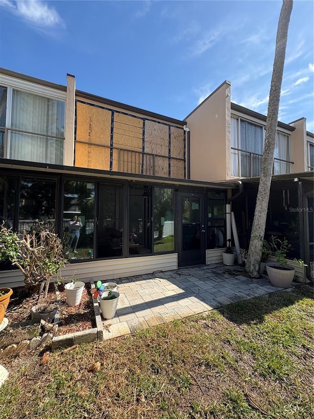 rear view of property with a patio area