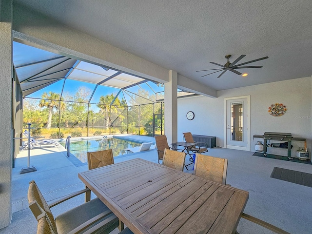 view of patio / terrace with a lanai and ceiling fan