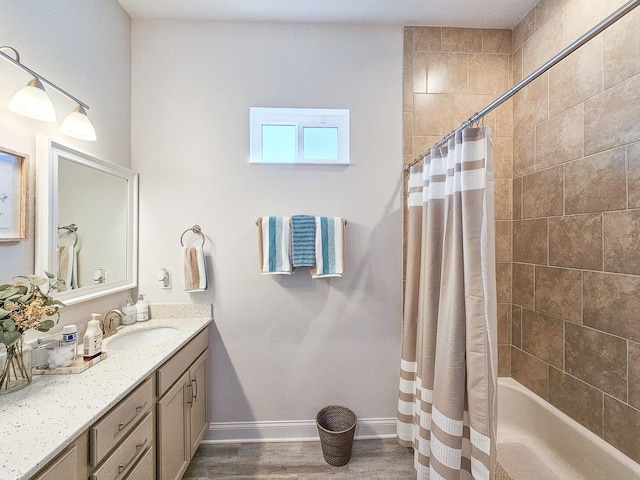 bathroom featuring shower / tub combo, vanity, and hardwood / wood-style floors